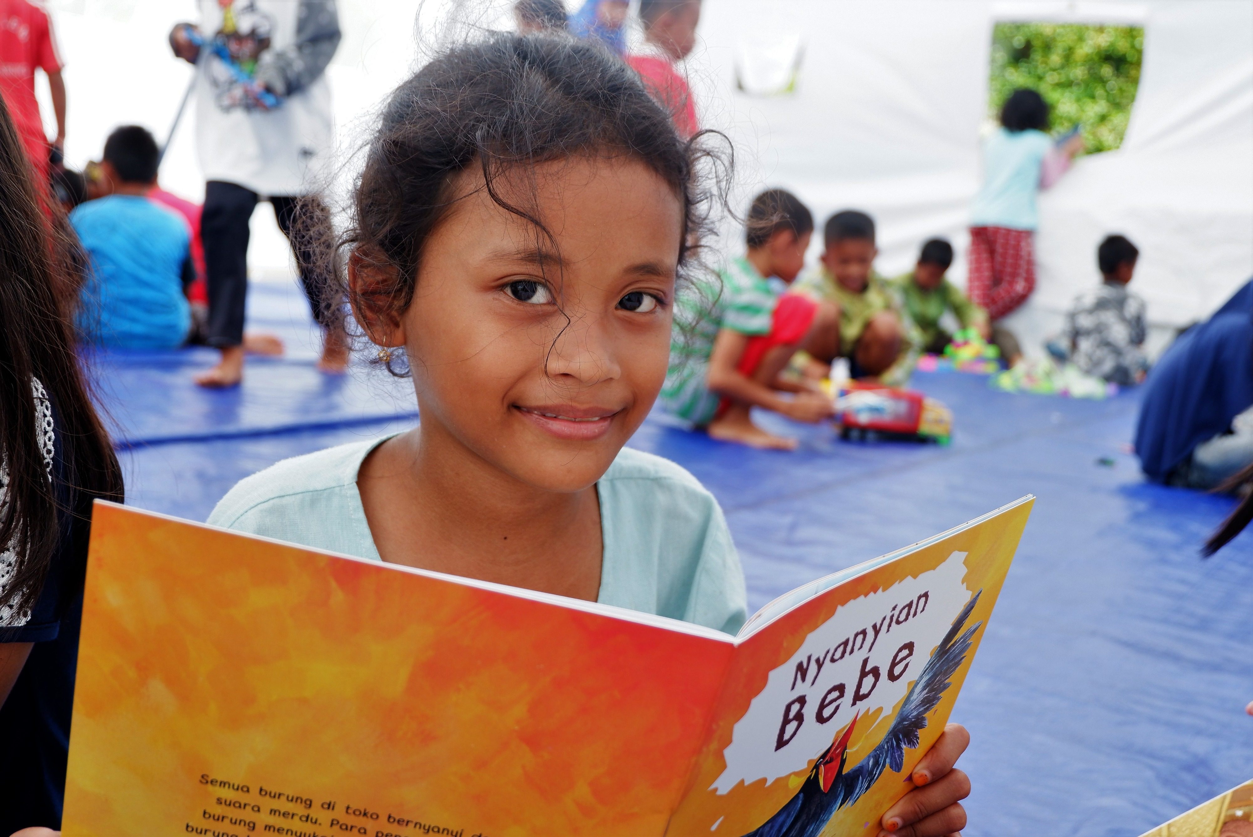 A grateful girl who received help from Save the Children