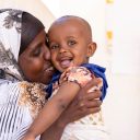 CH11303052_Marwo, 25, kisses her daughter Mahdiya, 11 months old, who is suffering from malnutrition-zg